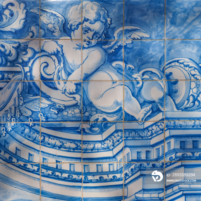 Traditional Portuguese, glazed ceramic tiles on building wall in the street of Oeiras. Azulejos whit