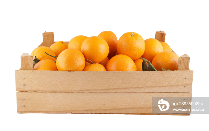 Fresh and ripe orange fruits in wooden box isolated