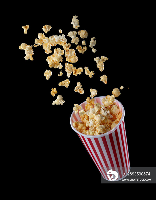 Popcorn flying out of the package isolated on black background