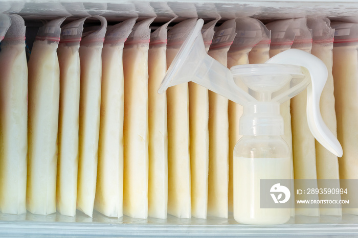 Stock of breast milk frozen in storage bags and a pump bottle for a new baby of family with love in 