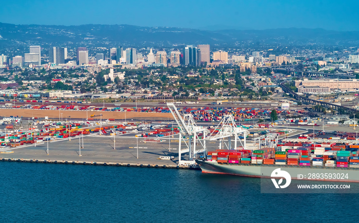 Oakland Harbor port terminal with cargo ship and shipping containers