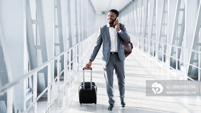 Busy Businessman Traveller Talking on Phone, Walking Inside Airport