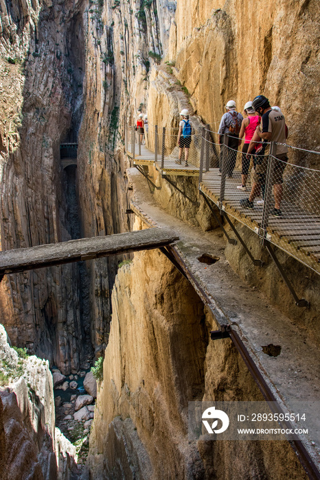 On the Caminito del Rey. Hikers and tourists stand on the footbridge that overlooks the ancient path