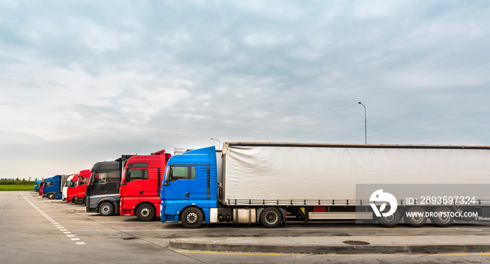 Trucks on parking, cargo transportation in Europe