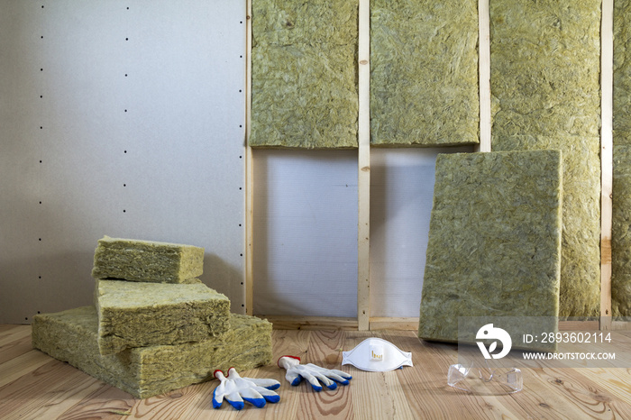 Rock wool and fiberglass insulation staff material for cold barrier. Tools for work with glass wool: