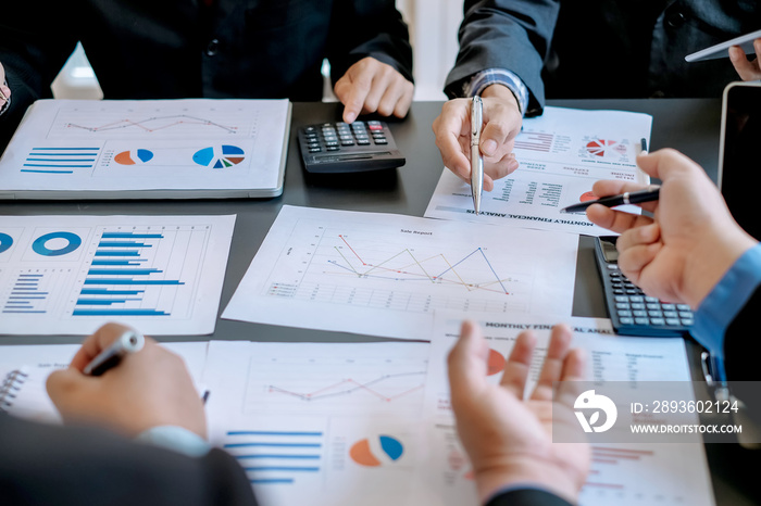 Business people brainstorm, discuss, plan and analyze business investment data graphs in meeting roo