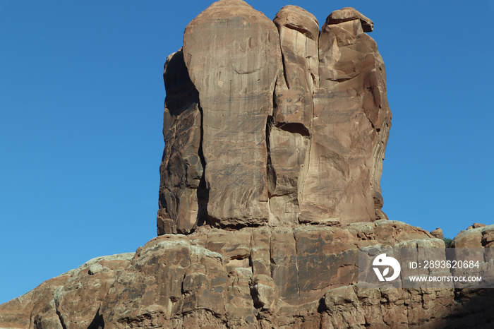 Scenic view of rugged layered rock landscape in Utah, United States on a sunny day