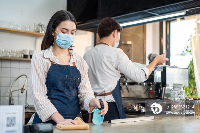 Barista waiter clean cafe restaurant to reopen after Covid19 lockdown