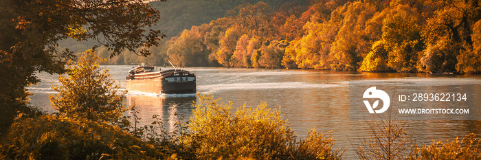 Peniche sailing on the Seine river in France on an autumn day