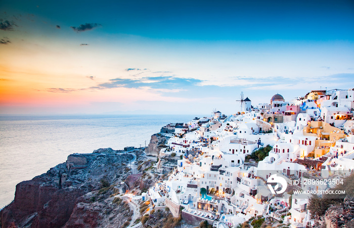 amazing view of Oia town at sunset in Santorini, Cyclades islands Greece - amazing travel destinatio