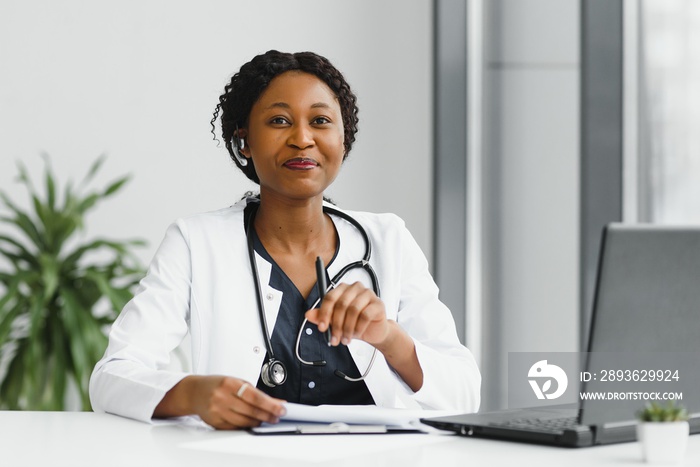 medicine, online service and healthcare concept - happy smiling african american female doctor or nu