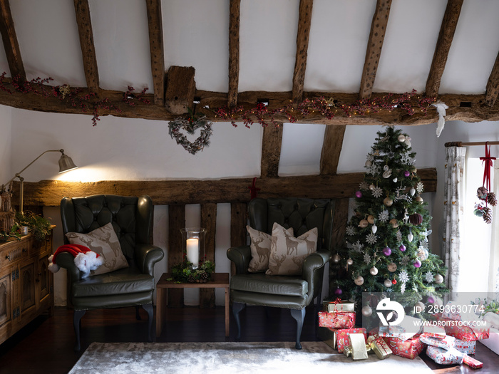 Christmas tree with presents in living room