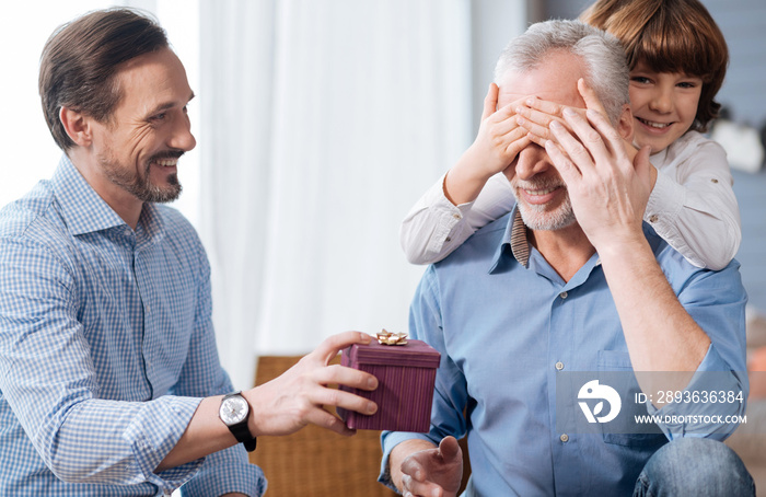 Nice elderly man having his eyes closed