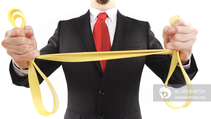 Headless businessman stretching rubber band