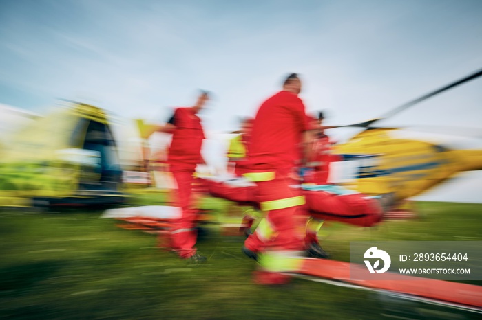 Team of emergency medical service in blurred motion