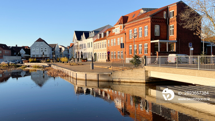 Slow travel Denmark: Old townhouses and the river Vidå at the entrance into the town of Tønder