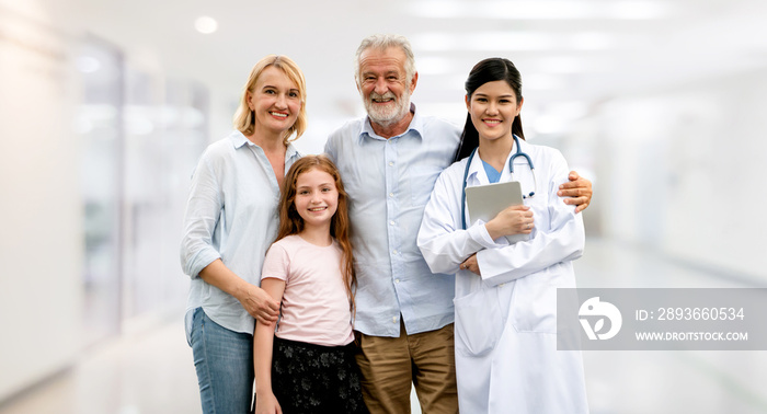 Doctor with happy family at hospital.