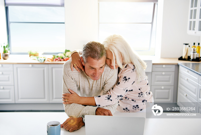 Two elderly people browsing the Internet