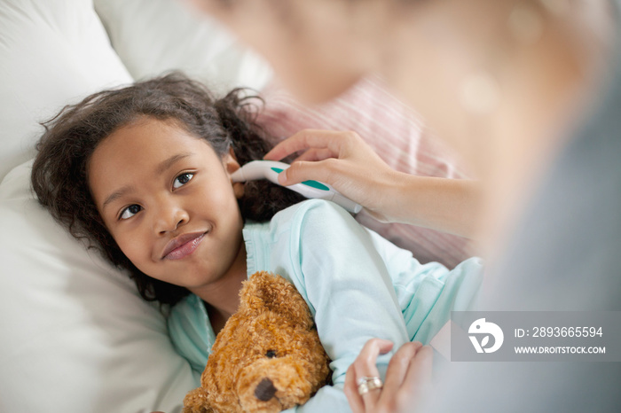 mother attending to sick child