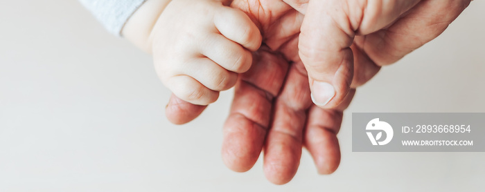 An old woman and a kid holding hands together