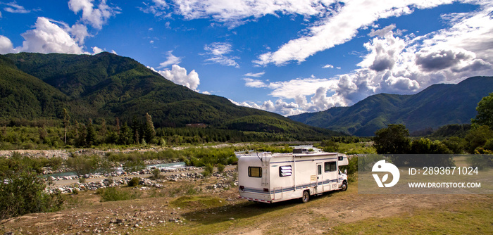 Motorhome in Chilean Argentine mountain Andes. Family trip travel vacation on Motorhome RV in Andes.