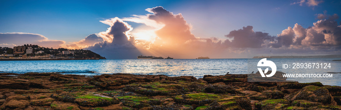 Panorama of Torquay and Cruise ferry during the sunrise in Devon in England in Europe.