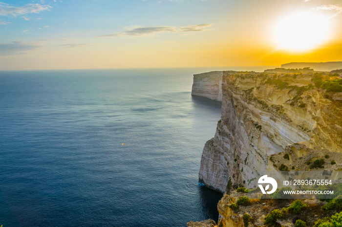 Sunset view over Ta Cenc cliffs on Gozo, Malta