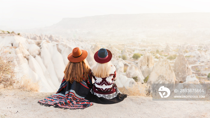 Traveling women wearing authentic boho chic style poncho, sweeter and hats smiling and have a fun  i