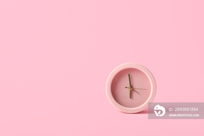 Alarm clock on color background