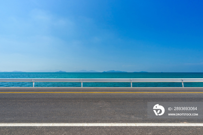 asphalt road and tropical beach