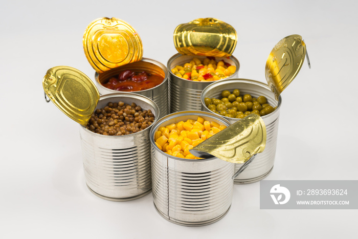 Canned food on white background. Green pea, beans, corn, lentils.