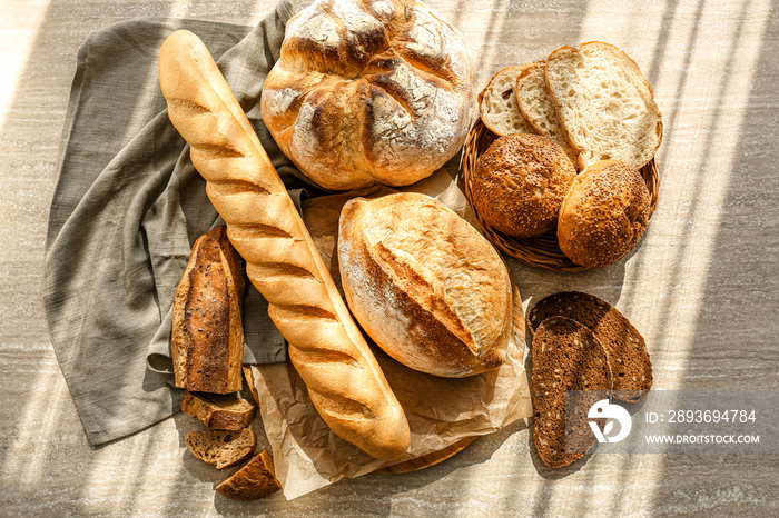 Assortment of fresh bread on table