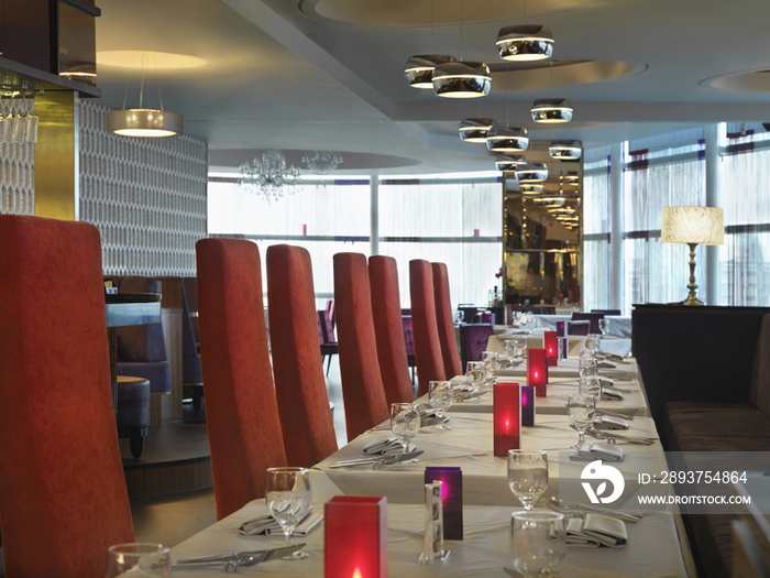 Interior of dining area with tall back chairs in luxury hotel