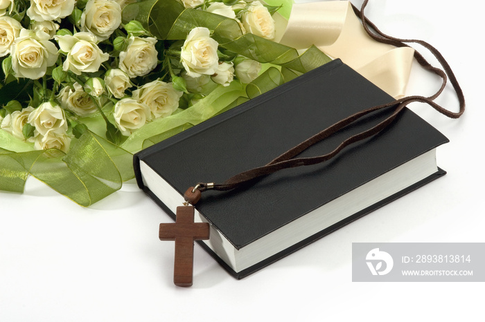 Bible, crucifix , roses on white