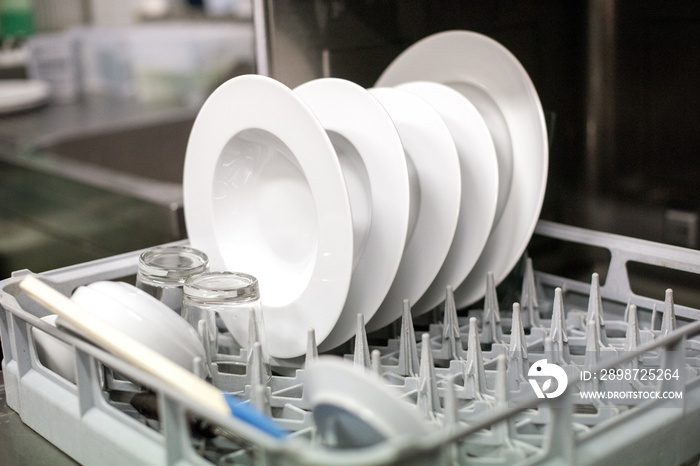 Close up view of clean plates in a dishwasher