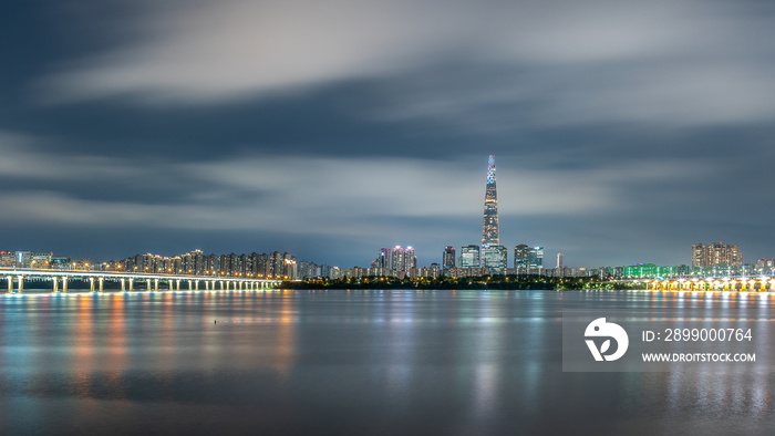 Night view of Lotte World Tower skyscraper and Han River in Seoul South Korea