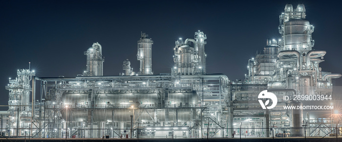 Panoramic view of a chemical factory at night.