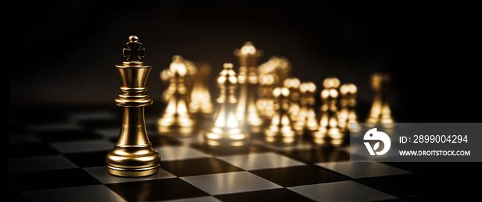 Close-up king chess standing first in line teamwork on chess board concepts of business team and leadership strategy and organization risk management.