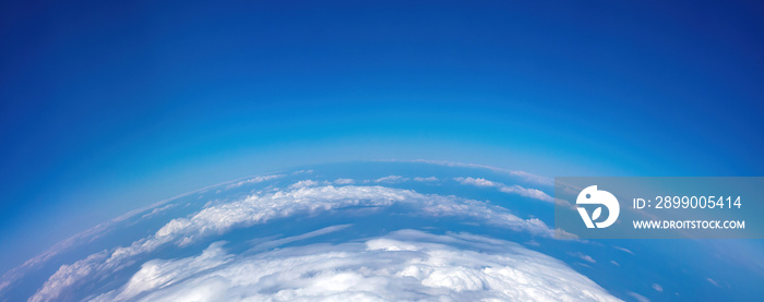 Curvature of planet earth. Aerial shot. Blue sky and clouds