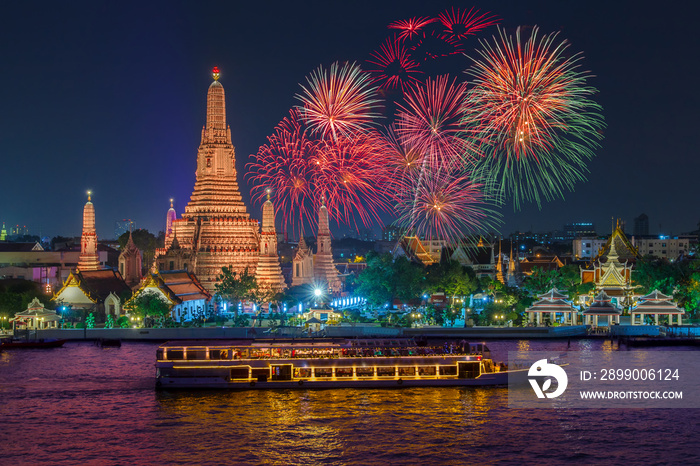 Wat arun and cruise ship in night time under new year celebration, Bangkok city ,Thailand