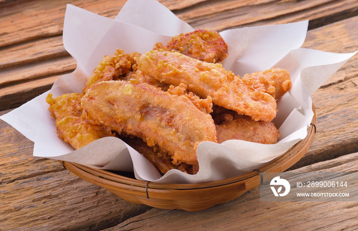 Fried bananas on wooden background