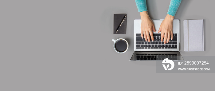 Person using a laptop computer from above