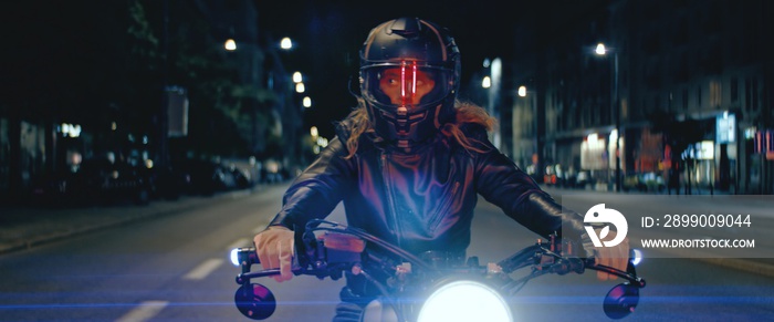 Biker riding his custom built cafe racer motorcycle through city at night. Shot with 2x anamorphic lens