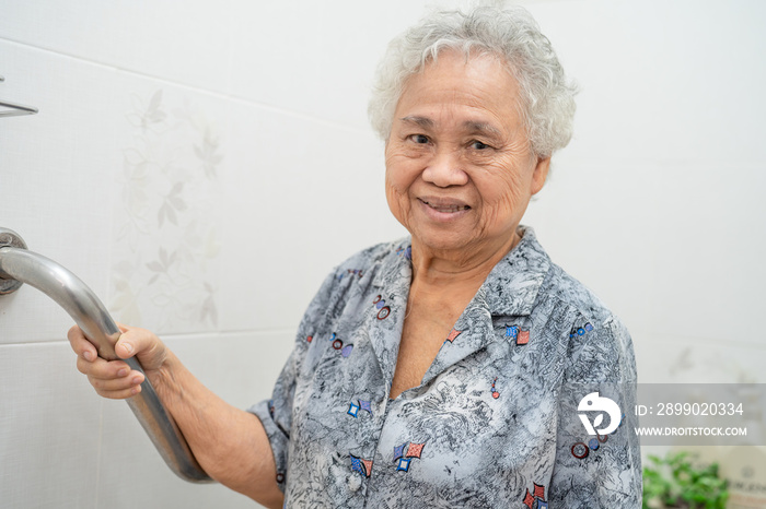 Asian senior or elderly old lady woman patient use toilet bathroom handle security in nursing hospit
