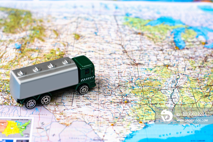 Miniature truck on a road map. Concept for visualization of delivery services, logistics, forwarding