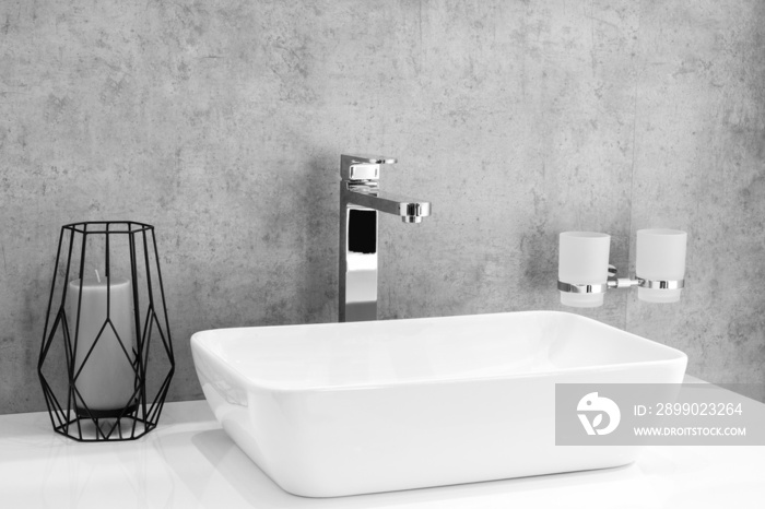 Bathroom interior with sink and faucet.