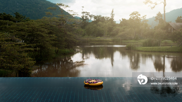 Outdoor swimming pool over tropical forest