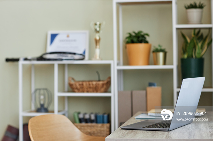 Background image of open laptop at home office workplace, side view