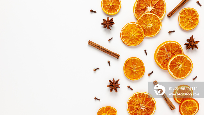 Christmas composition with dried oranges and spices on white background. Natural food ingredient for