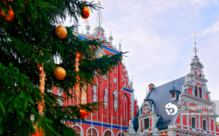 Fragment of House of Blackheads and Christmas Tree in Riga in Latvia. Street Xmas and holiday fair i